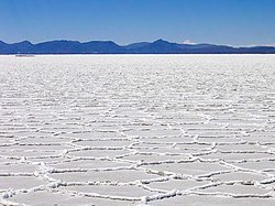 Hexagonal formations on the surface of the Salar de Uyuni as a result of salt crystallization from evaporating water