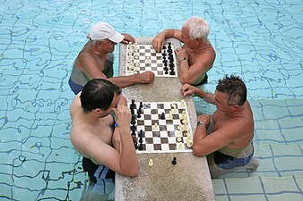 Chess players in the Széchenyi baths of Budapest, Hungary.