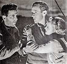 Bogart and Leslie Howard looking at each other, with Davis clinging to Howard