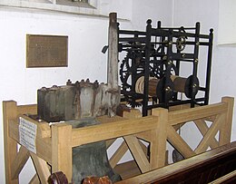 Wooden framework containing metal mechanical mechanism.