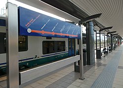 A train and a route map at Arechi station