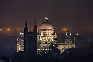 Victoria Memorial with St. Paul's Cathedral, Kolkata, in the foreground.