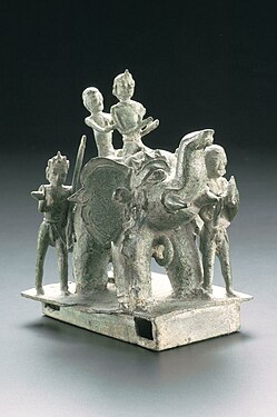 A statue of bronze elephant with riders, made in the 13th–14th century East Java (Singhasari and Majapahit era).