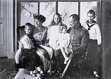 Couple with four children in early 20th century dress