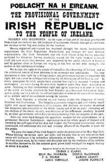 "Black and white photograph of the one-page Proclamation of the Irish Republic, 1916; dense printed text with larger headings and signatures at the bottom"