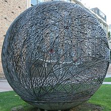 A three-metre-diameter globe-shaped bronze sculpture fabricated out of brazed copper alloy wire