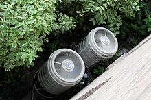 Photograph two fans, the outdoor section of a heat pump