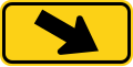 W16-7PR Downward diagonal arrow to the right (plaque)[e]