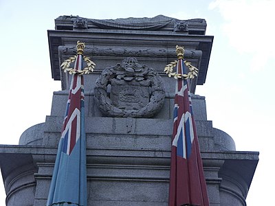 Southwest flags and carved wreath enclosing the arms of Rochdale