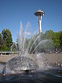 View of the Space Needle with the International Fountain in the foreground.