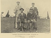 Team photograph of a rifle shooting team, in black and white.