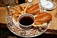 French dip, with bowl of jus for dipping