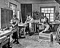 Image 1Students in a carpentry trade school learning woodworking skills, c. 1920 (from Vocational school)
