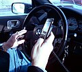 Image 62A New York City driver holding two phones (from Smartphone)