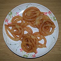 Jilapi in Bangladesh, generally consumed as a sweetmeat, is a popular starter at social events.