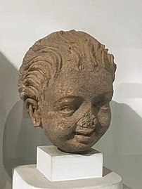"Laughing boy", stucco from Gandhara, 2nd–3rd century CE