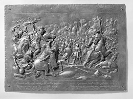 An ancient battle scene in metal relief