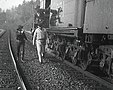 Robbers walking away from the uncoupled train cars
