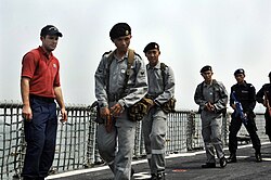US Coast Guard directs Royal Brunei Navy personnel aboard USS Crommelin (FFG-37) during CARAT 2009.