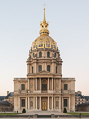 Photo of a domed building built of stone with gilt on the upper dome.