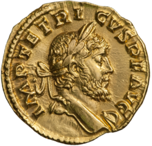 The obverse of a golden coin showing the face of Tetricus.