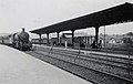 View of the second platform of the N.S. station in Valkenburg. with a train approaching train on the left pulled by the steam locomotive NS 4312 (ex War Department). (03-07-1947)