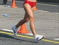 Image 25A racewalker "flying" (entirely out of contact with the ground, a rule violation) (from Racewalking)