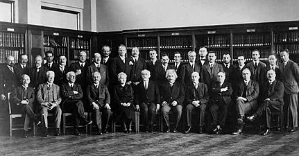 Sixth Conference, 1930. 1st row: Th. de Donder, P. Zeeman, P. Weiss, A. Sommerfeld, M. Curie, P. Langevin, A. Einstein, O. Richardson, B. Cabrera, N. Bohr, W. J. De Haas; 2nd row: E. Herzen, E. Henriot, J. Verschaffelt, C. Manneback, A. Cotton, J. Errera, O. Stern, A. Piccard, W. Gerlach, C. Darwin, P. A. M. Dirac, H. Bauer, P. Kapitsa, L. Brillouin, H. A. Kramers, P. Debye, W. Pauli, J. Dorfman (ru), J. H. Van Vleck, E. Fermi, W. Heisenberg[12]