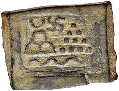 Taxila single-die local coinage. Pile of stones, hill, river and Swastika (220-185 BCE).