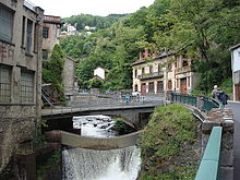 Narrow river valley, with bridges and buildings