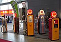 Display of various antique fuel pumps at Retro Classics 2018 in Stuttgart, Germany.