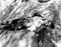 Dead German female guard from the Ohrdruf Concentration Camp. She was killed either by the U.S. troops or by the prisoners.