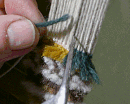 Knitting an asymmetric knot, open to the right, with a knitting hook similar to the Tabriz type