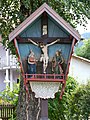 Wooden wayside cross in Völs, Tyrol, Austria.