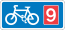 Rectangular, blue traffic sign with a white bicycle symbol and a red square with the number 9 in it.