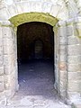 Segmental arched doorway to the parlour from the cloister.