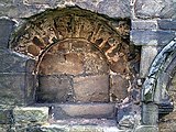 Piscina or wash drain for ritual ablutions in the south wall of the chancel or presbytery.