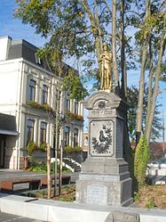 The town hall and war memorial in Attiches