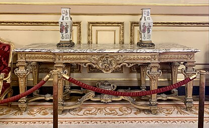 Large console with central projection; by Benjamin Deguil and Benjamin-Paul Ramillon; 1850-1875; gilt wood and marble; 100 x 283 x 77 cm; Napoleon III Apartments, Louvre Palace, Paris[169]