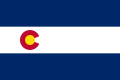 The flag of Colorado (1911–1964), a charged horizontal triband.