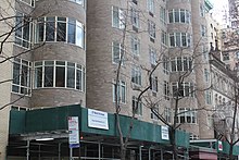 View of the Rockefeller Apartments in March 2021, with scaffolding in front of the facade