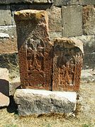 Khachkars standing in front of the west facade.