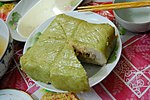 Bánh chưng a savoury rice cake with mung beans and pork fillings, usually consumed during Tết