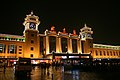 The Beijing railway station at night in 2008 after the station's English sign was added in advance of the 2008 Summer Olympic Games