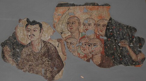 Part of a wall painting showing Buddha with his disciples
