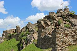 Stone castle ruins against a blue sky