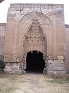 A large stone gate with stone-carved decoration