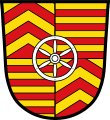 Stadt Rieneck Geviert mit sechsspeichigem silbernen Rad in der Schildmitte; 1 und 4: fünfmal sparrenförmig geteilt von Gold und Rot, 2 und 3: neunmal geteilt von Gold und Rot.