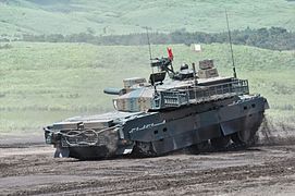 A Type 10 leans forward on its suspension as it decelerates