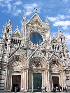 The polychrome façade of Siena Cathedral, Italy, has Byzantine, Romanesque and Gothic elements.